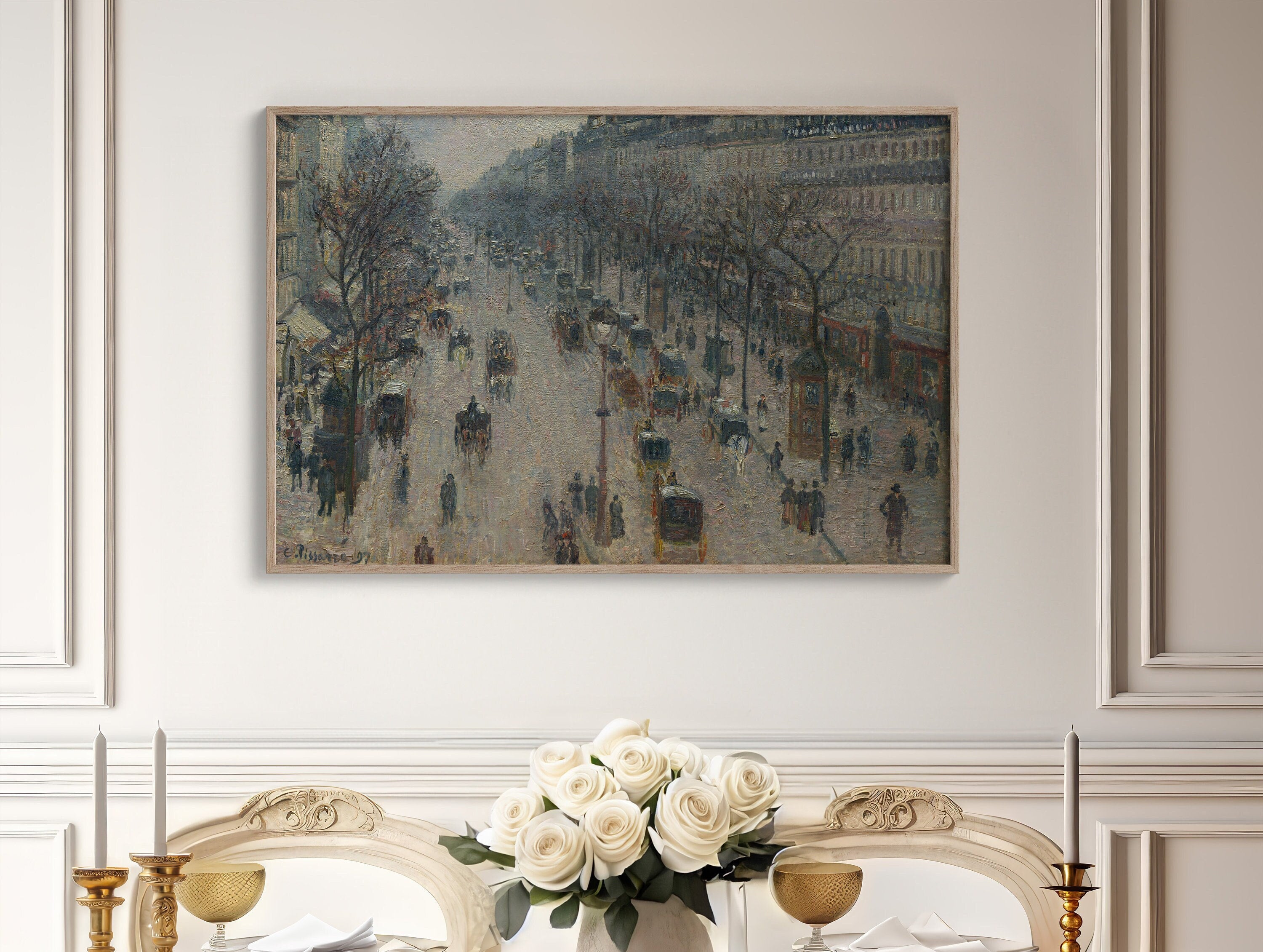 Large Parisian Winter Canvas Print by Camille Pissarro, depicting snowy cityscape with people and buildings in 19th century Paris, creating a cozy and nostalgic atmosphere