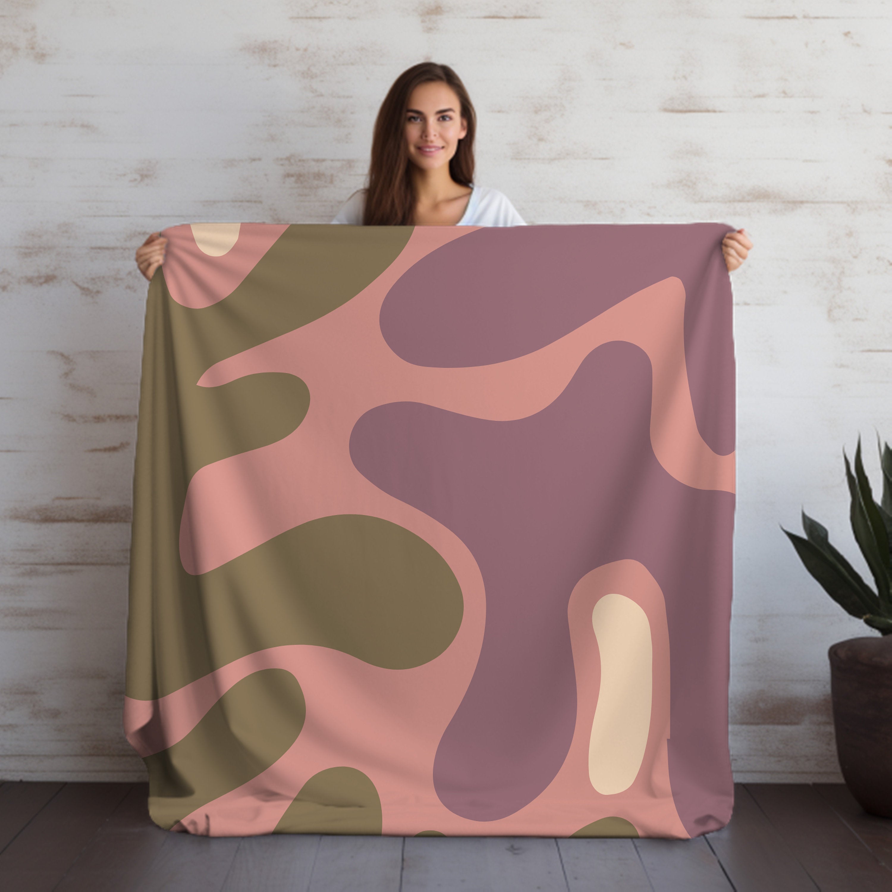  Elegant pink velveteen throw blanket with a rich and velvety texture, ideal for adding a touch of luxury and warmth to any room