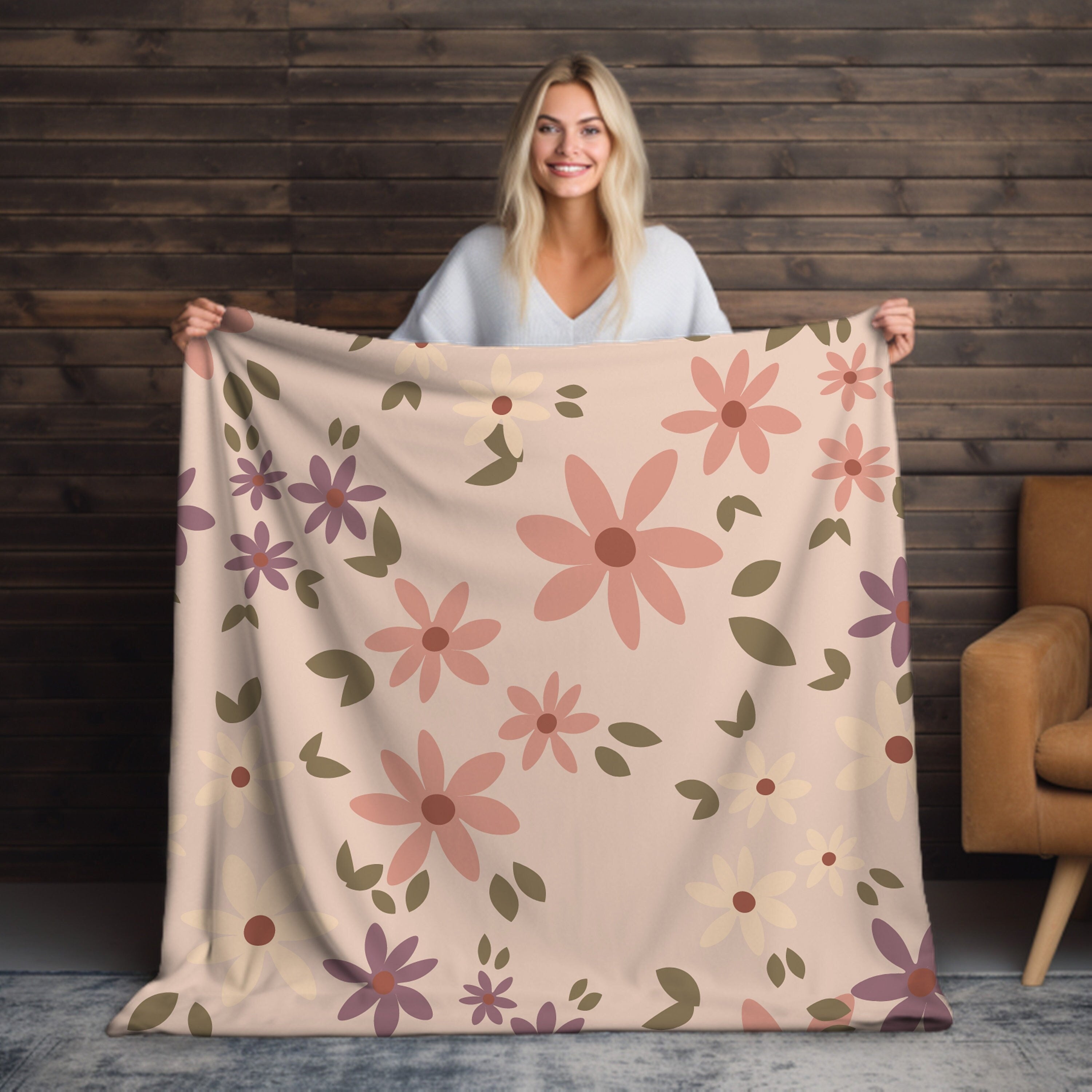 Velveteen throw blanket in pink with boho design on sofa